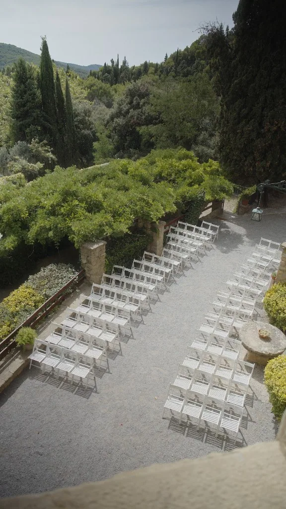 Ceremony chairs on the gravel court at La Baronia
