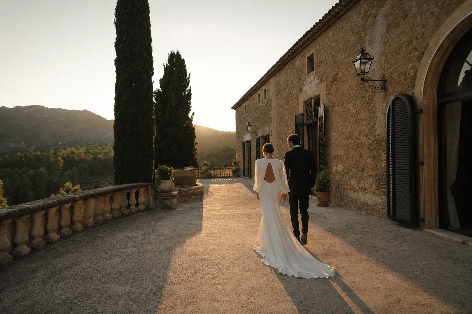 Cinematic golden-hour wedding film frame on a Spanish terrace