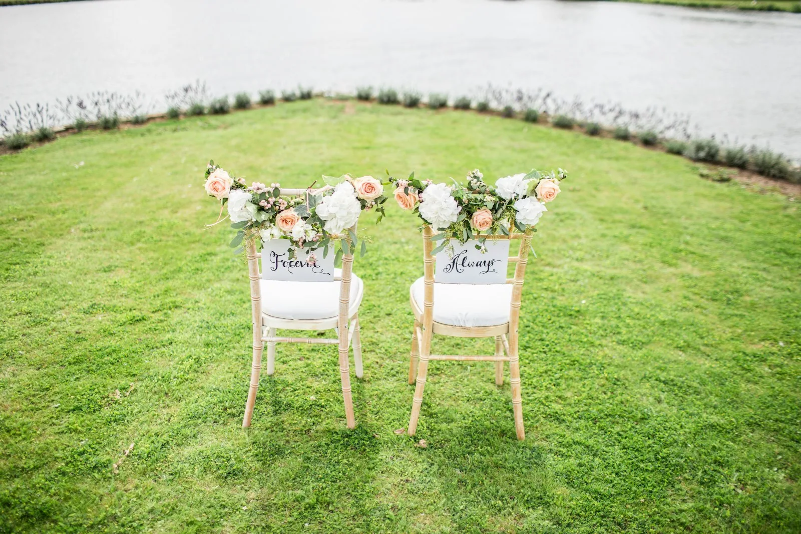 Wedding ceremony setup on Spanish terrace with string lights and Mediterranean sea view at sunset