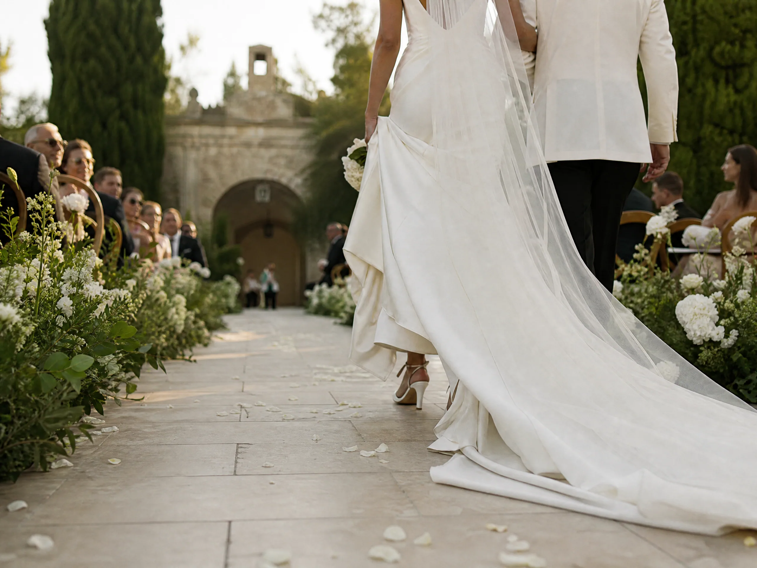 Wedding ceremony in Spain: Design for heels, hems, and the camera’s low angle